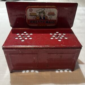 VINTAGE SMALL METAL PRETTY MAID STOVE. Child Toy.